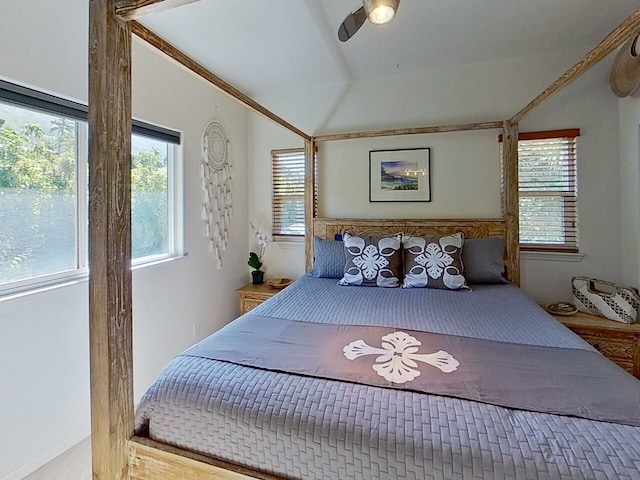 bedroom featuring ceiling fan, ornamental molding, and vaulted ceiling