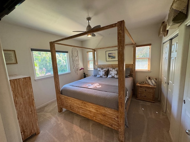 bedroom featuring dark carpet and ceiling fan