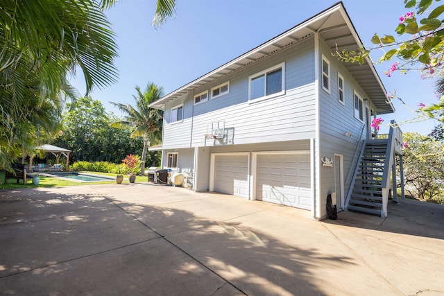 view of side of home with a garage