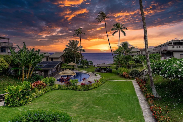 yard at dusk with a water view