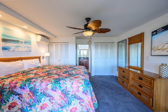 bedroom with multiple closets, ceiling fan, dark colored carpet, and a wall unit AC