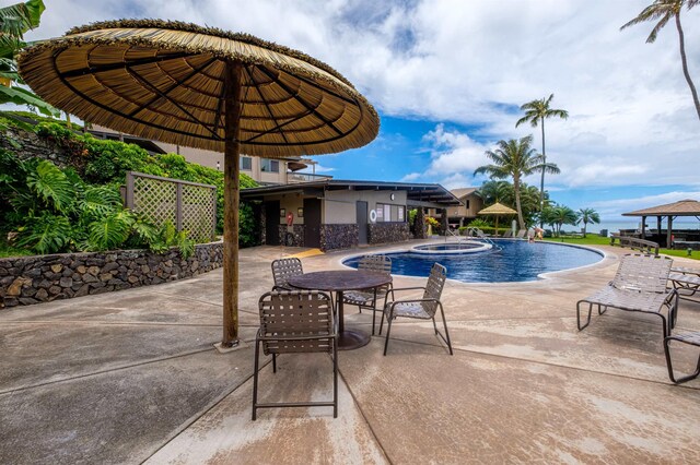 view of swimming pool with a gazebo, a hot tub, and a patio