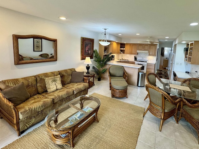 living area with light tile patterned flooring, recessed lighting, and ceiling fan