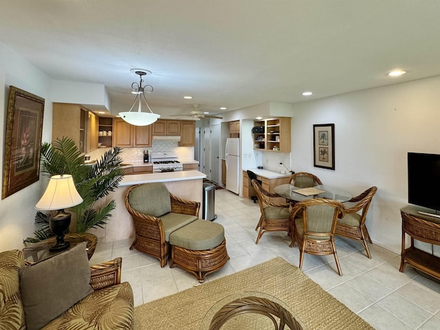 living room with ceiling fan, light tile patterned floors, and recessed lighting