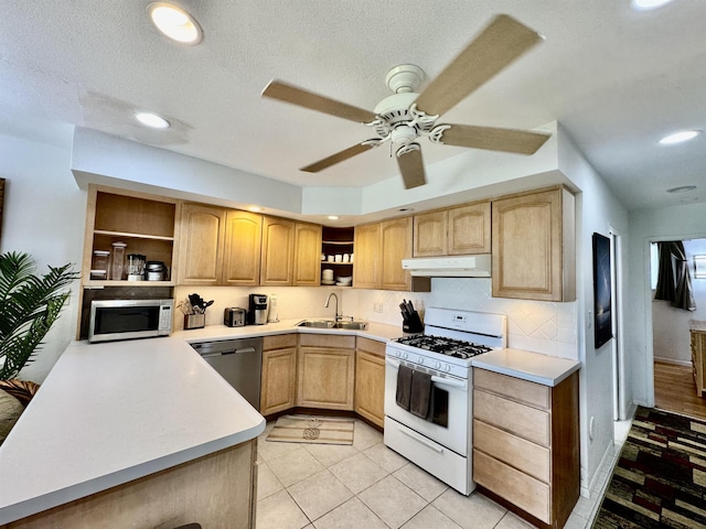 kitchen featuring open shelves, white appliances, light brown cabinets, a sink, and under cabinet range hood