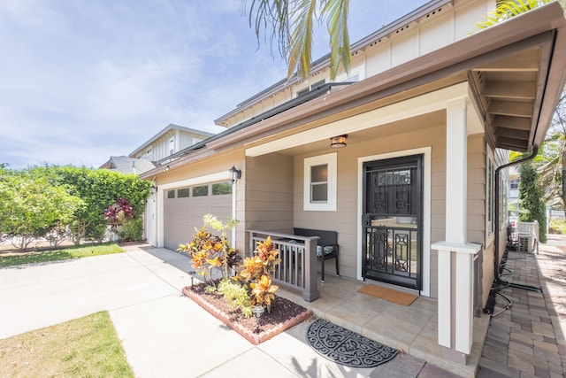 view of front of home with covered porch and a garage