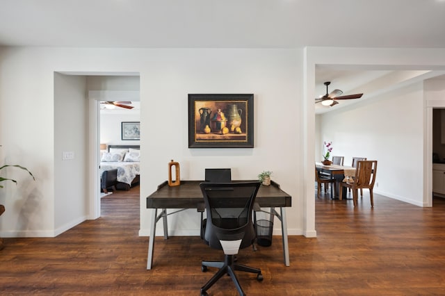 office featuring dark wood-style floors, baseboards, and ceiling fan