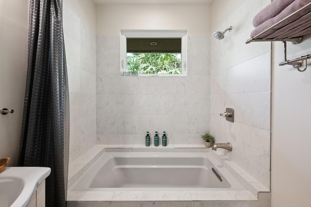 full bath featuring tiled shower / bath