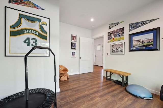 workout area featuring recessed lighting, wood finished floors, and baseboards