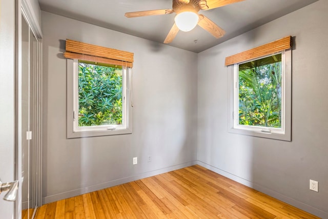 spare room with ceiling fan and light hardwood / wood-style flooring