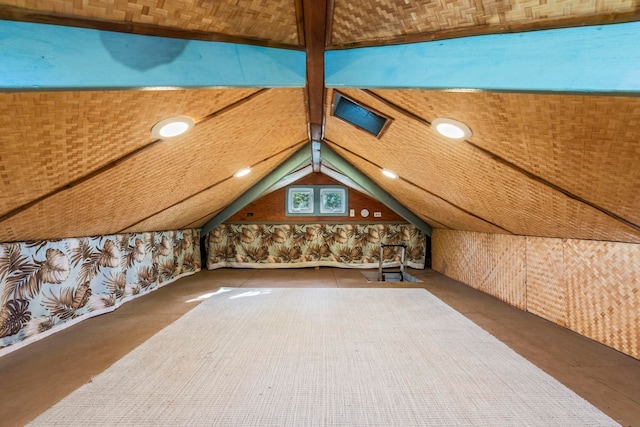 additional living space with brick ceiling and vaulted ceiling