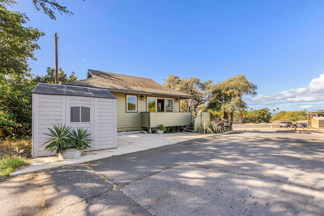 exterior space featuring a storage shed