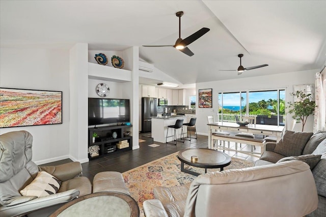 living area with a wall unit AC, baseboards, a ceiling fan, and lofted ceiling