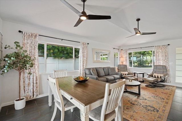 dining room with dark wood-style flooring and a ceiling fan