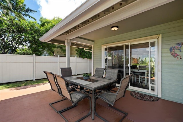 view of patio / terrace featuring fence and outdoor dining area