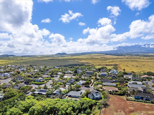 drone / aerial view featuring a residential view and a mountain view