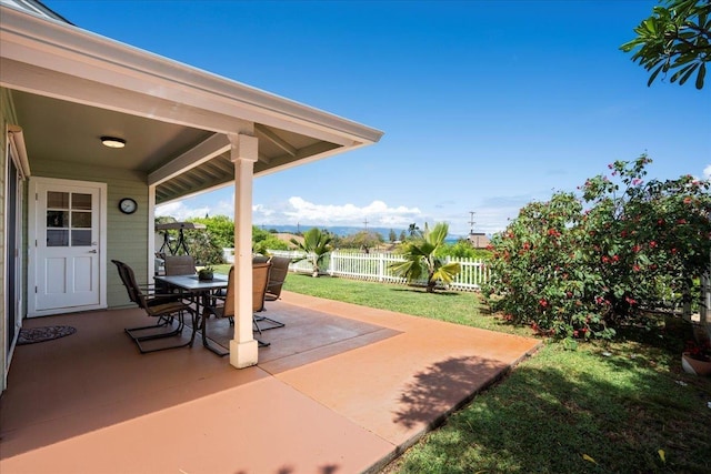 view of patio featuring fence