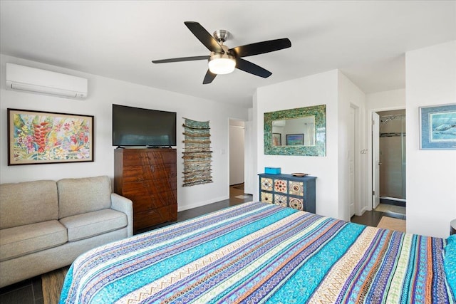 bedroom featuring a ceiling fan, wood finished floors, an AC wall unit, and a spacious closet