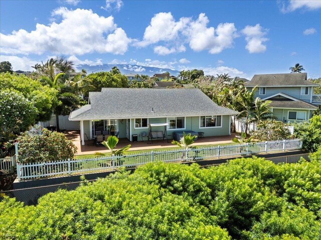 view of front of house featuring fence
