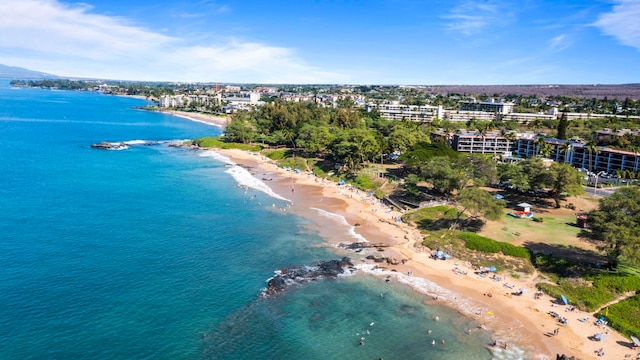 birds eye view of property with a view of the beach and a water view