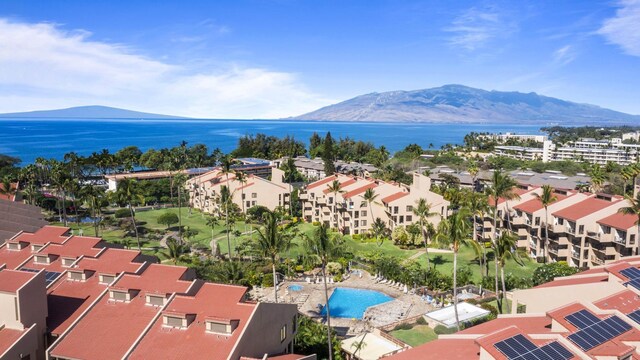 birds eye view of property featuring a water and mountain view