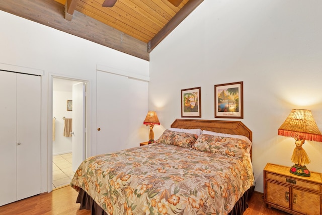 bedroom with wooden ceiling, vaulted ceiling with beams, hardwood / wood-style floors, and ceiling fan