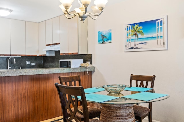 dining room featuring a chandelier