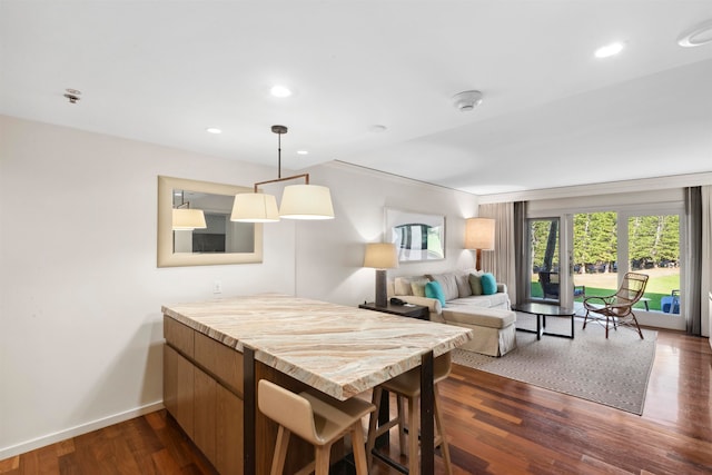 dining area featuring dark hardwood / wood-style floors