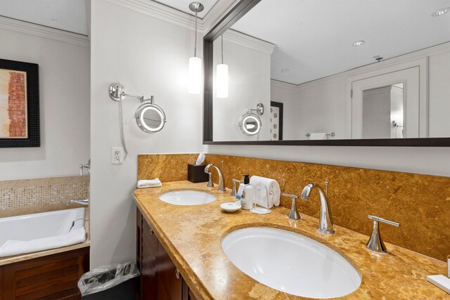 bathroom featuring ornamental molding, double vanity, and a bath to relax in