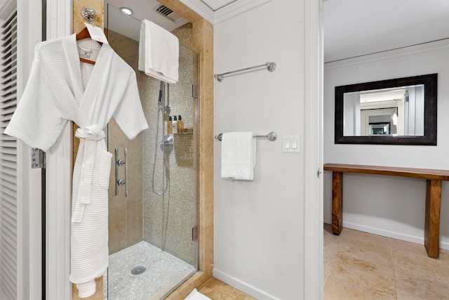 bathroom with an enclosed shower, crown molding, and tile floors