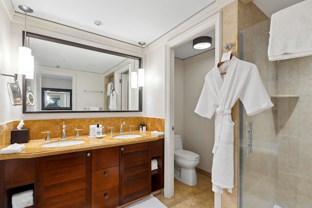 bathroom featuring tile flooring, double vanity, walk in shower, crown molding, and toilet