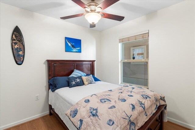 bedroom featuring ceiling fan and wood-type flooring