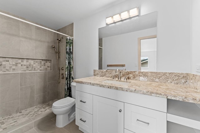 495 Kaiolohia St, Kihei, HI 96753 - bathroom featuring toilet, tile patterned floors, tiled shower, and vanity
