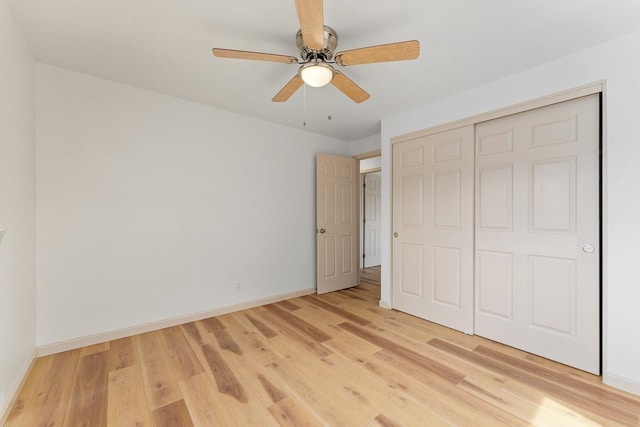 495 Kaiolohia St, Kihei, HI 96753 - unfurnished bedroom featuring a closet, a ceiling fan, baseboards, and light wood-type flooring