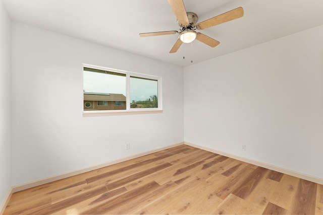 495 Kaiolohia St, Kihei, HI 96753 - spare room with a ceiling fan, light wood-style flooring, and baseboards