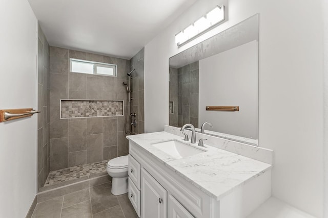 495 Kaiolohia St, Kihei, HI 96753 - full bathroom featuring a tile shower, toilet, tile patterned flooring, and vanity
