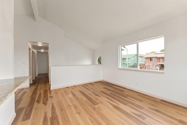 495 Kaiolohia St, Kihei, HI 96753 - empty room featuring baseboards, vaulted ceiling with beams, and light wood-style floors