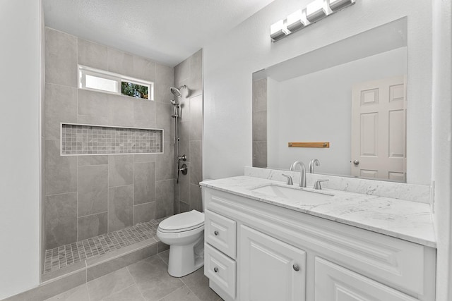 495 Kaiolohia St, Kihei, HI 96753 - full bath with toilet, tile patterned floors, tiled shower, and vanity