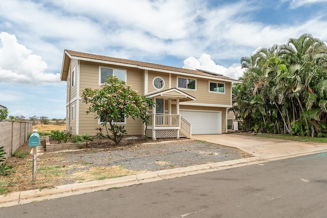 495 Kaiolohia St, Kihei, HI 96753 - traditional home featuring concrete driveway, a garage, and fence