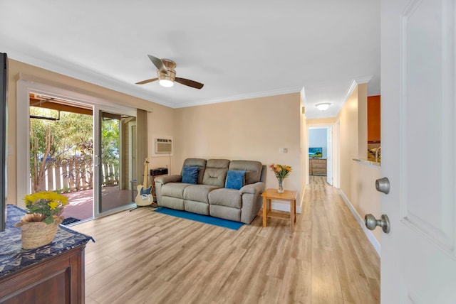 living room featuring ceiling fan, light hardwood / wood-style flooring, an AC wall unit, and ornamental molding