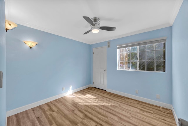 unfurnished room with crown molding, light hardwood / wood-style flooring, and ceiling fan