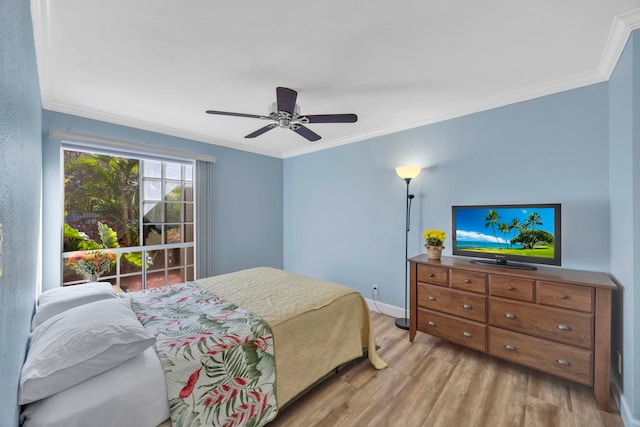 bedroom featuring light wood-type flooring, ceiling fan, and crown molding