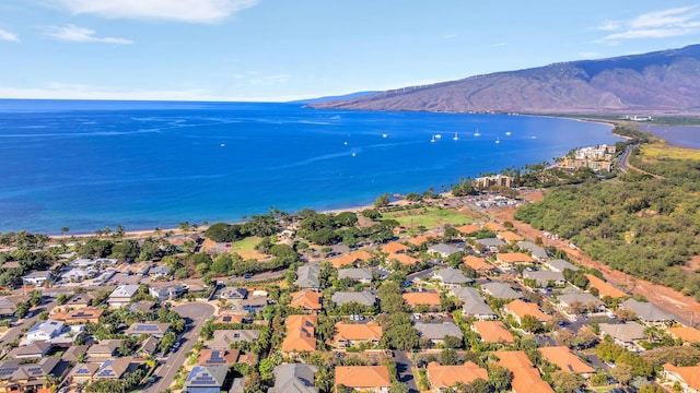 drone / aerial view with a water and mountain view