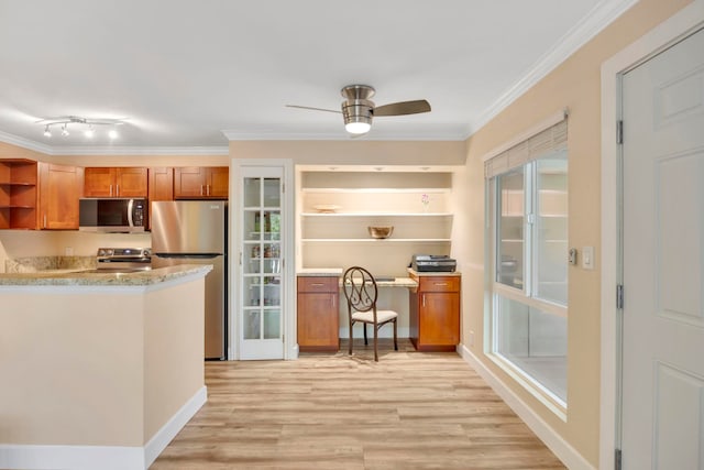 kitchen with ornamental molding, light hardwood / wood-style flooring, ceiling fan, and stainless steel appliances