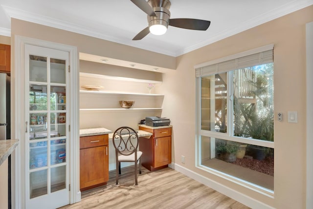 home office with crown molding, light hardwood / wood-style floors, and ceiling fan