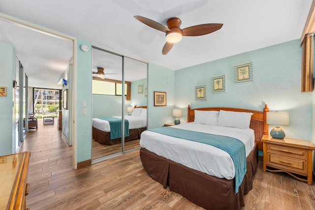 bedroom featuring a closet, ceiling fan, and wood-type flooring