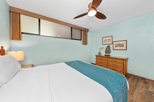 bedroom featuring wood-type flooring and ceiling fan