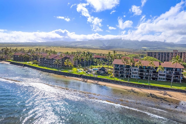 birds eye view of property with a beach view and a water and mountain view