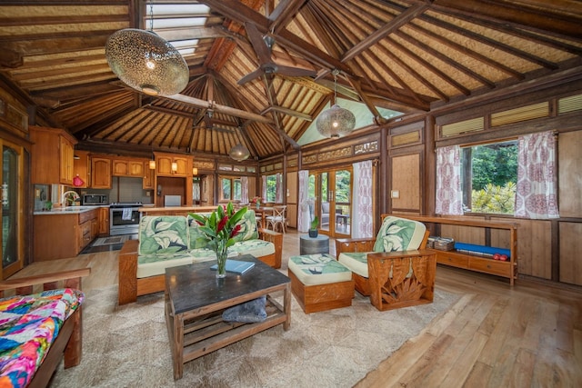 sunroom / solarium with vaulted ceiling and sink