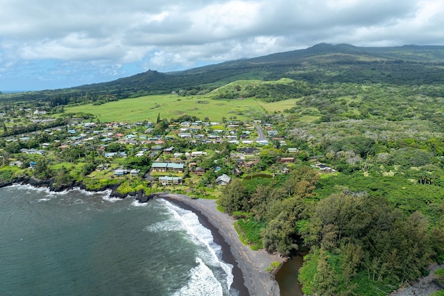 drone / aerial view with a water and mountain view